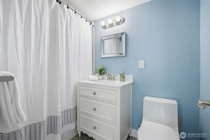 Primary bathroom is nicely updated.