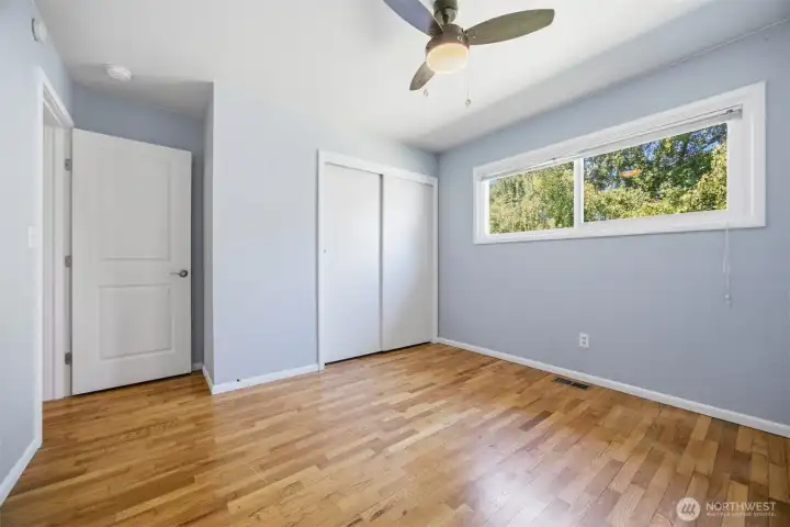 One of the additional bedrooms with a nicely places window to give natural light with privacy.