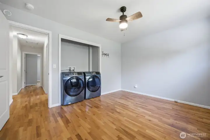 Far back bedroom has the washer and dryer in it. The room is large enough to create another closet if needed.