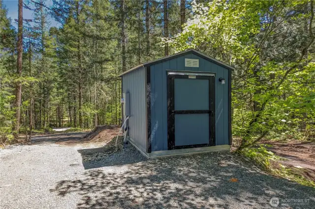 Shared wellhouse between 372 36 and 372 30 parcels. Electric meters mounted on either side of wellhouse for hookups to the properties