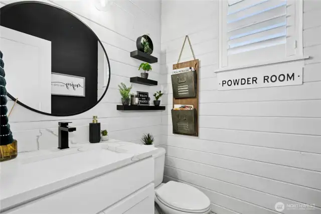Downstairs bathroom with added Quartz counters, shiplap and new hardware & faucet