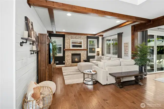 Custom Beams, shiplap, designer paint, shutters & Full height Stacked stone are just a few things to name here