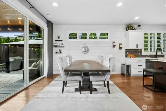 EXTRA Large slider out to the covered outdoor living area - large dining room/kitchen area with custom Shiplap and shutters