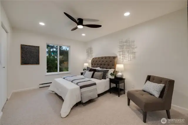 Spacious bedroom with modern ceiling fan and recessed lightings