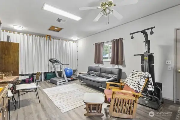 Heated bonus room as you enter from the breezeway to the shop/garage building.