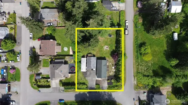 Drone view of the house located on a huge lot,  and  view of the neighborhood.