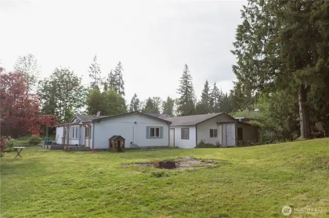 View of the house and garage from the backyard