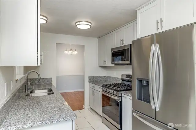 Tastefully updated kitchen with newer appliances and countertops.