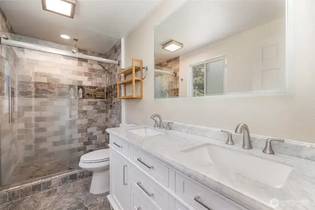 Tasteful primary bath.