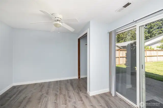 Family room opens to the patio and luxurious back yard with garden space.
