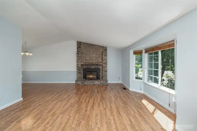 Wide open living room area opening to the dining room.