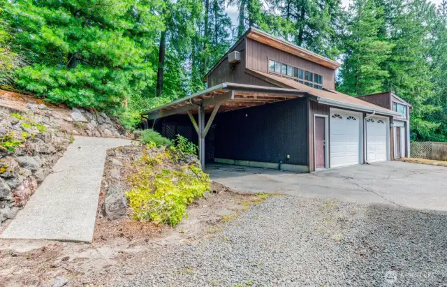 Another carport--detached two car garage and shop with a loft room above. Loft room formerly used as an office space