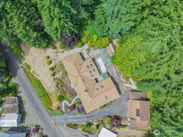 Drone shot of home, outbuildings and yard. Remember that the septic system was redone in Spring of 2025.