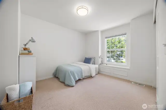 Room #2 bright and cheery has a window seat and built -in closet