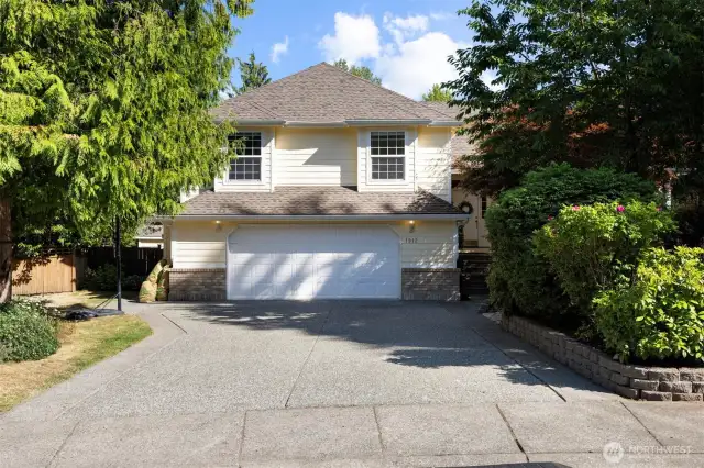 Deep two car garage and wide drive way can accommodate parking many cars