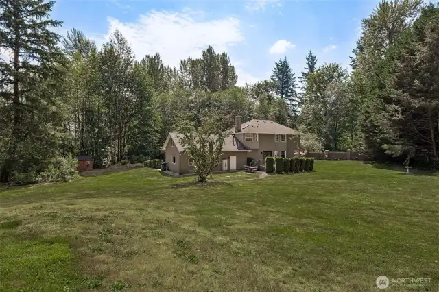 The home sits on approximately 1 acre of manicured land (mostly lawn).
