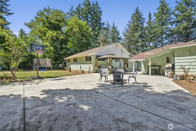Oversized patio and rear view of home and ADU