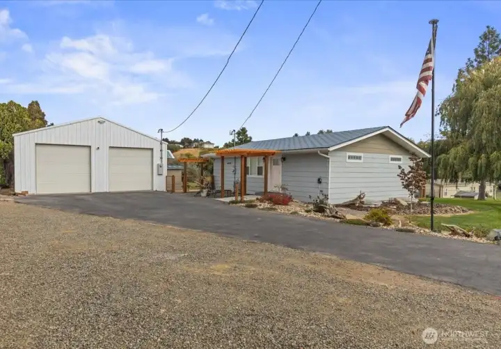 Front entry showing new fence and more landscaping