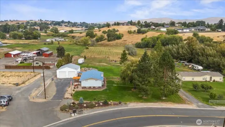Ariel front shows to back yard, and pasture side yard