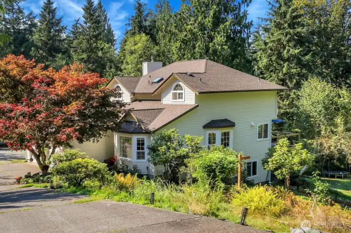 Nestled on 3.95 Parklike Acres with 117' of Lake Rowland Waterfront with a Circular Driveway for Easy Access!