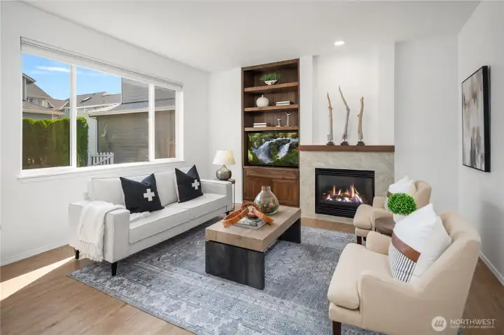Beautiful Douglas Fir built-ins and mantel over a gas fireplace are the center piece of this room
