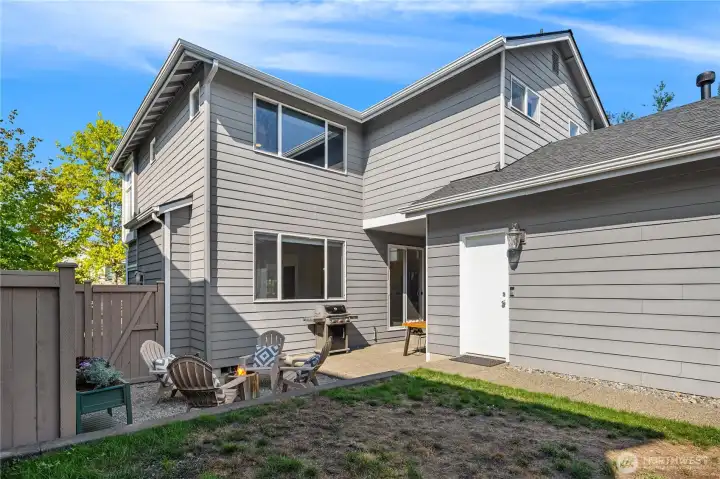 The garage features a walk-out door to the backyard