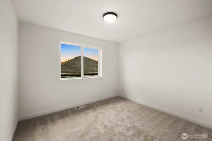 Additional Upper Level Bedroom: Light-filled secondary bedroom with plush carpet and a clean, neutral palette. Flexible in size and design, it’s well-suited for a variety of uses, from restful retreat to creative workspace.    Photos are from THIS model home at Foxmoore but are for visualization purposes only.