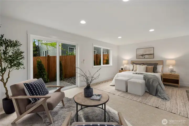 Lower-Level Bedroom or Bonus Suite: Expansive lower-level suite with multiple windows and direct patio access offers flexibility for use as a private guest retreat, media room, or home office. The generous layout provides comfort and convenience with endless possibilities for customization.    Photos are from THIS model home at Foxmoore but are for visualization purposes only.