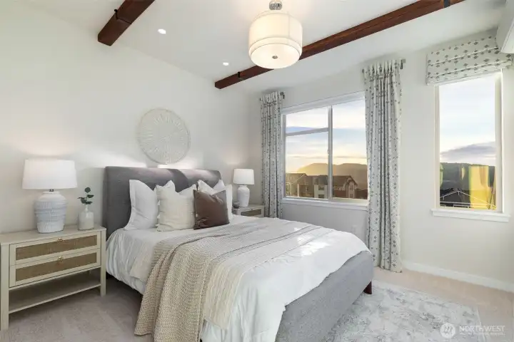 Primary bedroom with west facing mountain views.