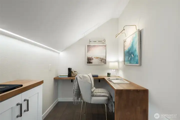 Bonus room with built in cabinets and desk/work space.