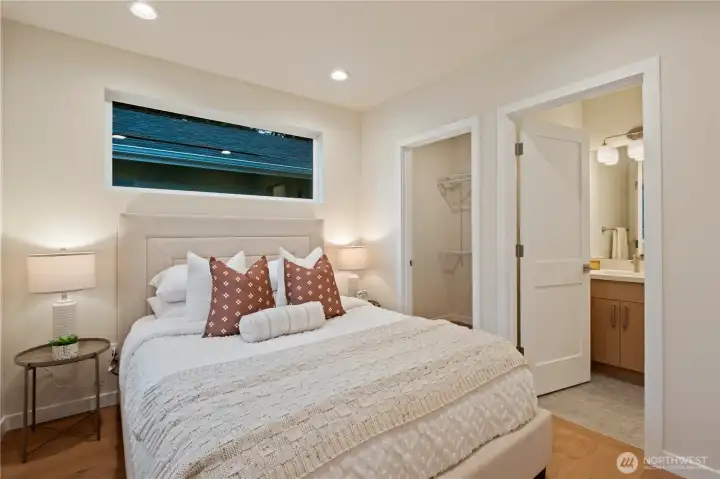 First of two suites upstairs features a full bath and walk-in closet.