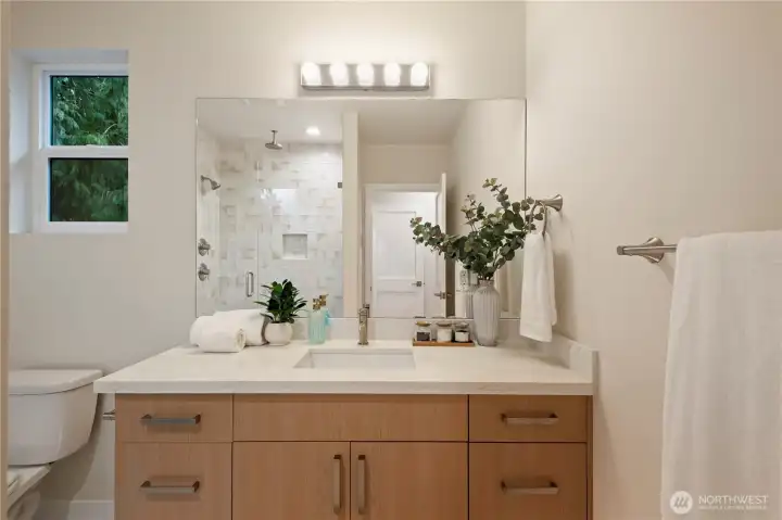 Plenty of storage in the bathroom vanity.