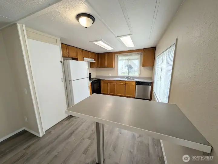 Breakfast bar/eating area.  Pantry to the left.