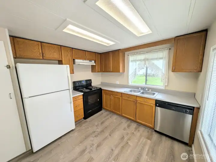 Kitchen overlooks huge backyard.