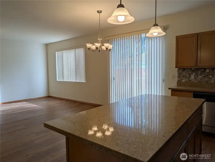 Dining area as well as Center Island with space for Counter stools. Sliders go outside to yard and patio