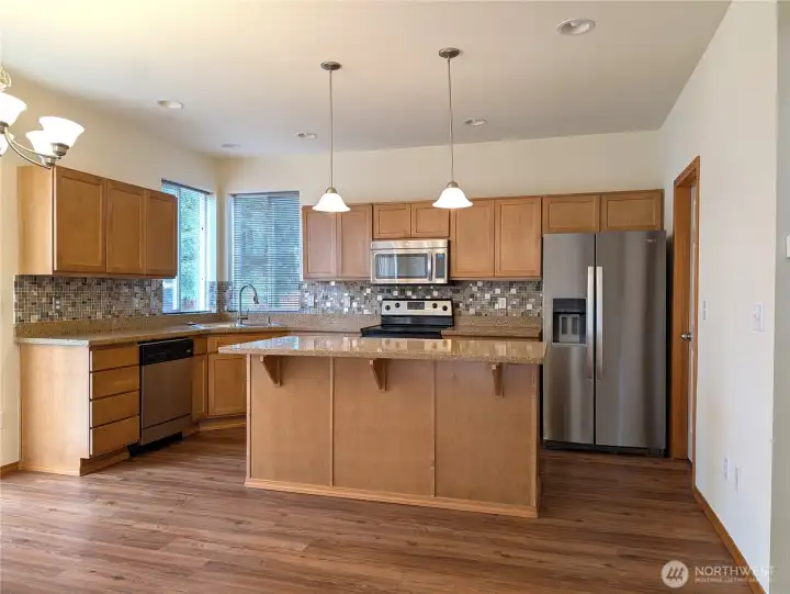 Center Island in Kitchen.  Seller did have small dining table in front of slider under chandelier
