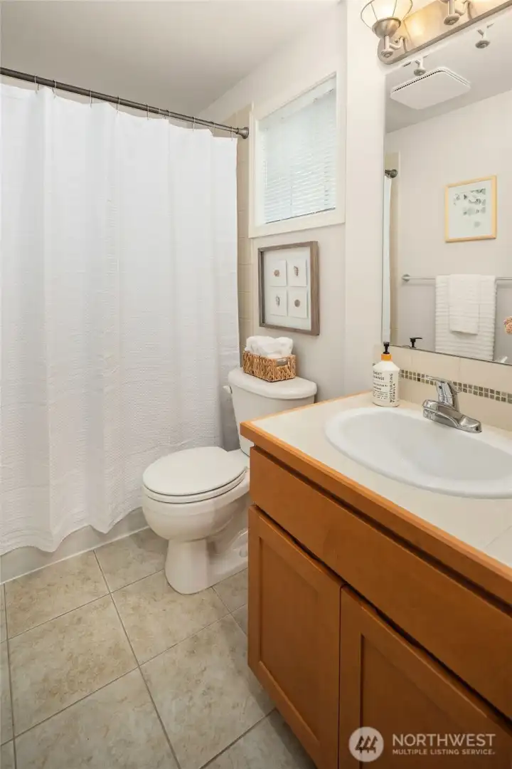 Full bathroom adjacent the kitchen.