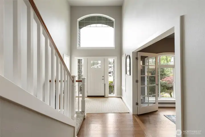 Light filled foyer with soaring ceilings welcomes you in.