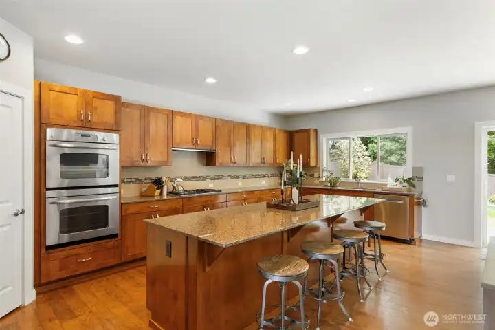 Another view of this incredible kitchen! Walk in pantry to the left.