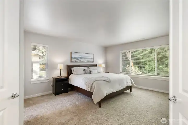 Enter Primary suite thru French Doors: features 2 closets, 5 piece bath ensuite and a LOT of space to relax.