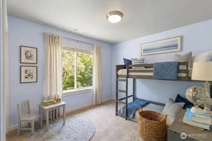 Bedroom 4 of 4 on second floor. Great view of backyard and custom closet system.