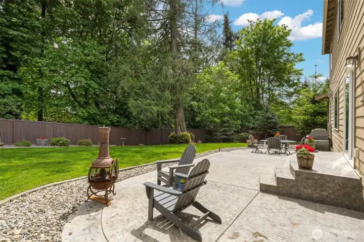 Incredible custom patio makes the backyard the perfect retreat from the world.