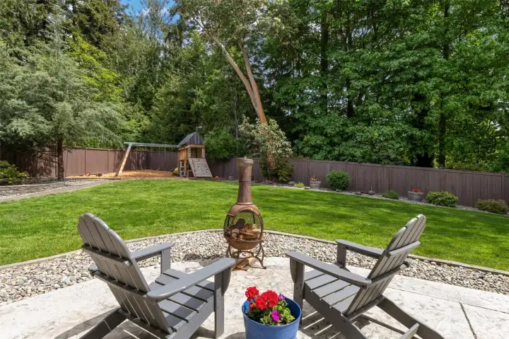Relax by a fire or watch the kids enjoy the custom play-structure.