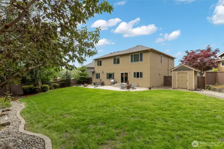Yard is quite level and spacious - also includes a terrific stick-built shed.