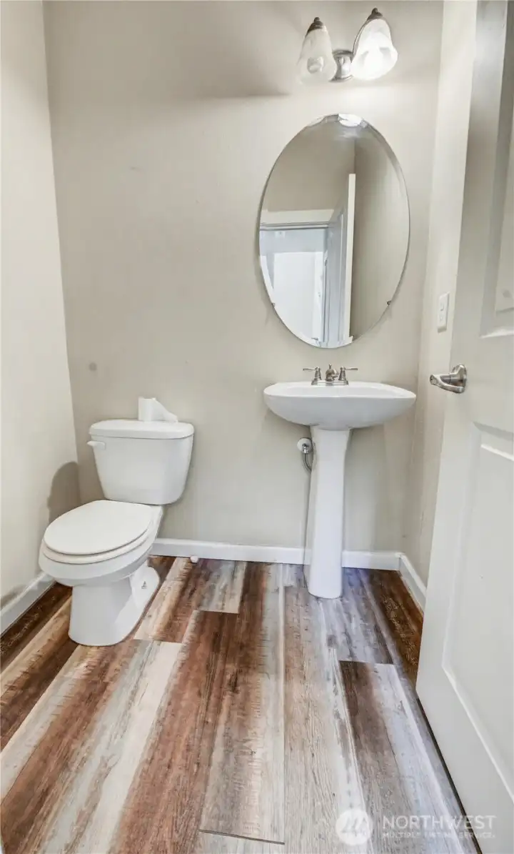 Half bath on main floor with LVP flooring