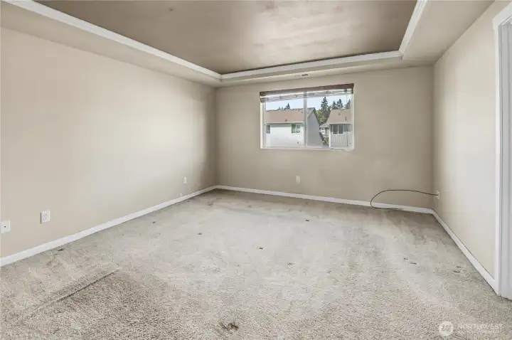 Primary bedroom located on upper level with double-door entry from hallway.