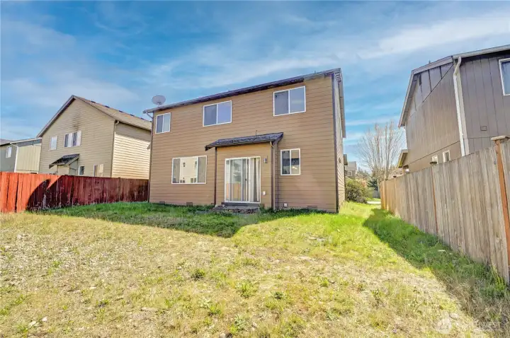 backyard - partially fenced with access to the alley way