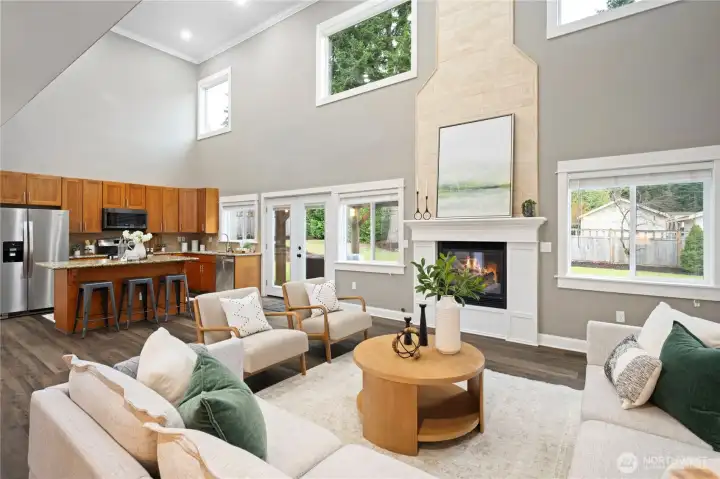 Impressive 2-story great room is filled with gorgeous natural light. French doors lead to the private fully fenced back yard.