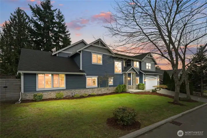 Covered front door entry and 2-car garage with room to park on the driveway and street.