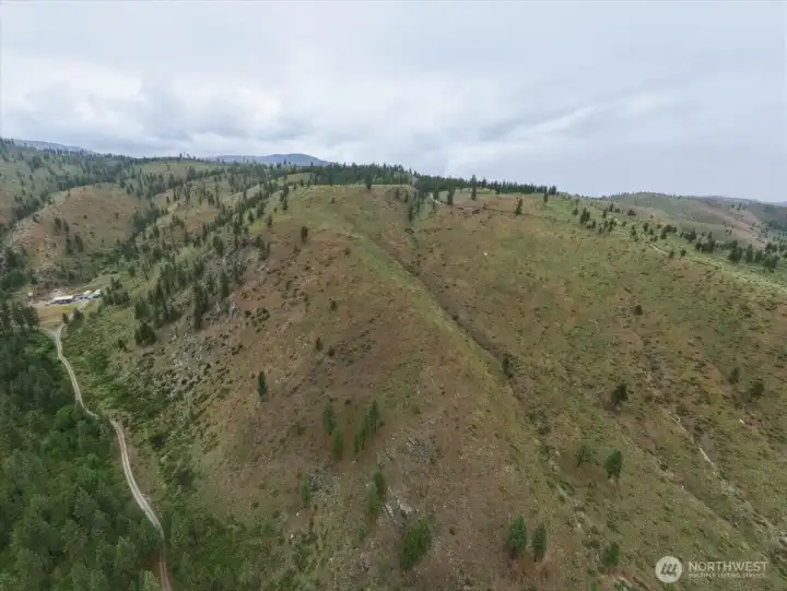 Aerial view 7 of property and topography. Aerial view 7 of property and topography.